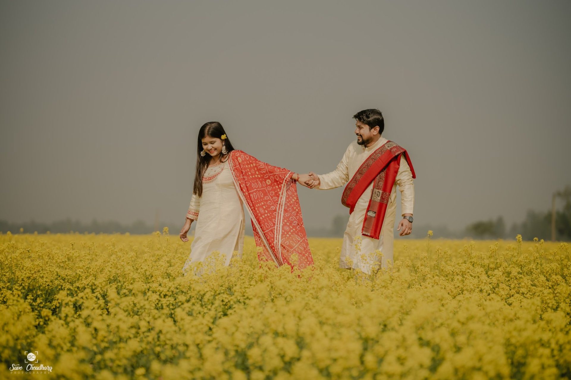 Wedding photographer in Siliguri – pre-wedding mustard field Raiganj – Suvo Weddings