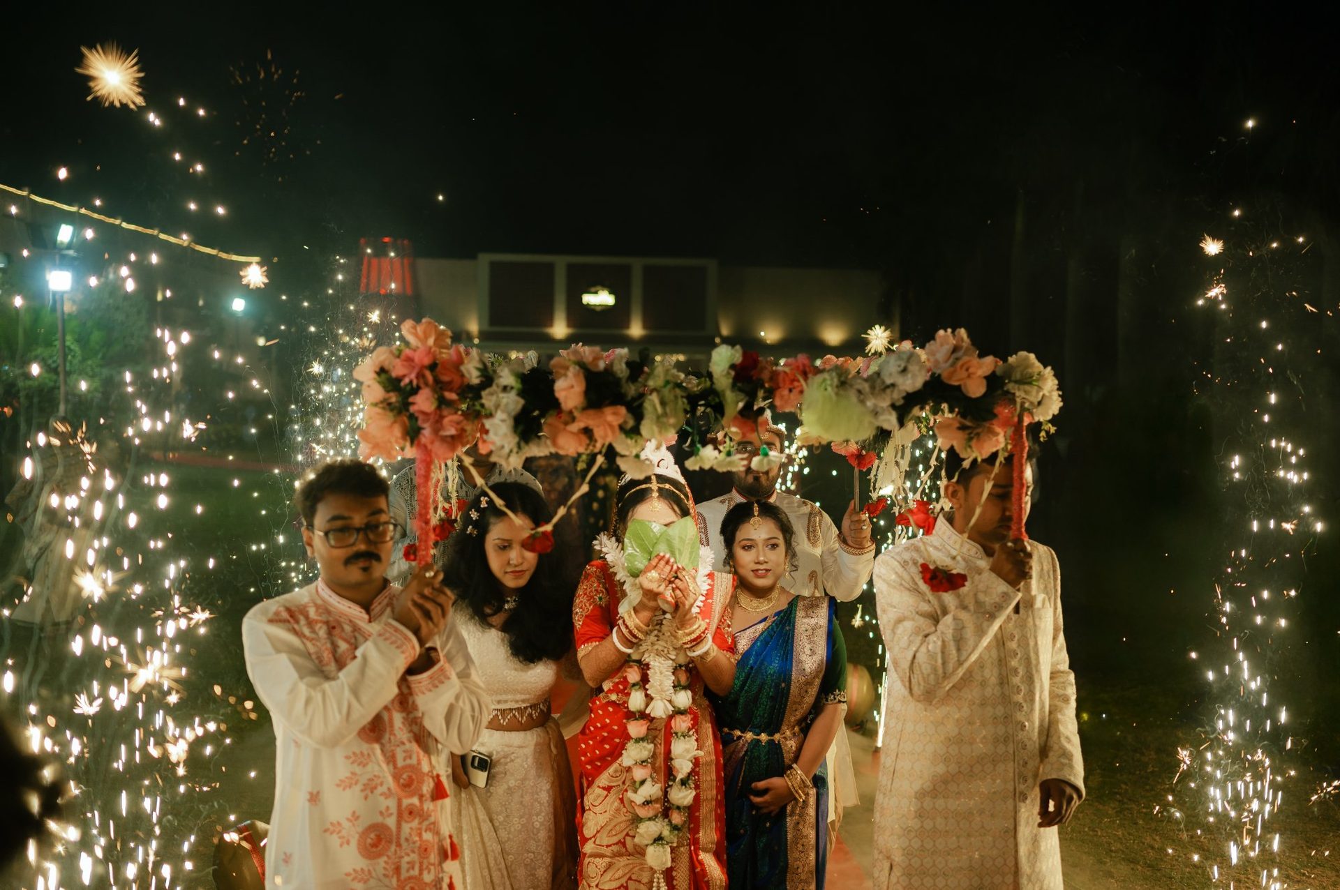 Wedding photographer in Siliguri – bride entry sparklers night – Suvo Weddings